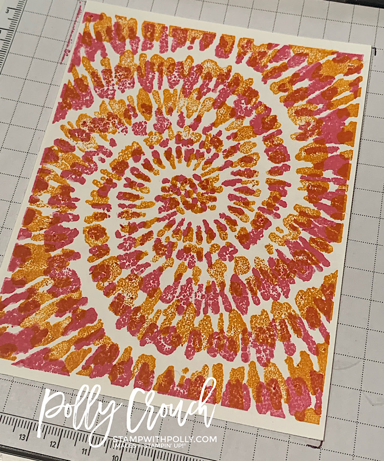 This is a picture of a piece of Basic White card stock stamped with the Spiral Dye in Polished Pink and Mango Melody.